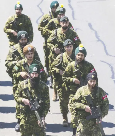  ?? ERNEST DOROSZUK / POSTMEDIA NEWS FILES ?? Members of the Canadian Armed Forces make their way along Toronto’s Lake Shore Boulevard as a part of the 41st annual Khalsa Day celebratio­n in April.