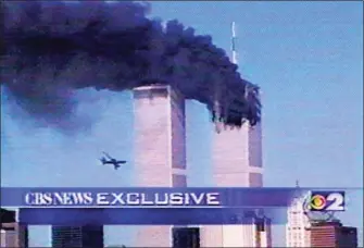  ?? AP Photo/CBS-TV ?? In this image fom television, a plane is seen flying toward the World Trade Center in New York, before crashing during a terrorist attack Tuesday, Sept. 11, 2001.