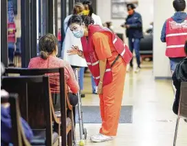  ?? Elizabeth Conley / Staff photograph­er ?? Houstonian­s wait in line to get the COVID-19 vaccine at HOPE Clinic last month. Scientists don’t yet know if vaccine immunity lasts longer than natural immunity.