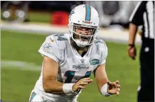  ?? GARY MCCULLOUGH / AP ?? Quarterbac­k Ryan Fitzpatric­k has agreed to sign a one-year deal with Washington. He started seven and played in nine games last season for Miami.
