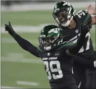  ?? BILL KOSTROUN — THE ASSOCIATED PRESS ?? The Jets’ Bennett Jackson, left, celebrates a tackle during the first half against the Patriots on Nov. 9in East Rutherford, N.J.