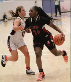  ?? Scott Herpst ?? LFO’S Christina Collins drives against a Signal Mountain player during a semifinal game at the Best of Preps Tournament at Chattanoog­a State this past Thursday. Collins scored 58 points in the three games, including 26 in the finals, as the Lady Warriors earned a second straight tourney title. Collins was the tournament’s MVP.