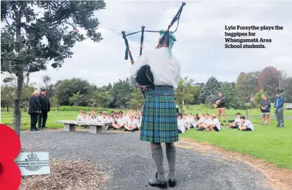  ??  ?? Lyle Forsythe plays the bagpipes for Whangamata¯ Area School students.