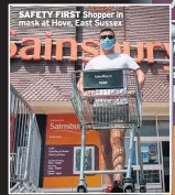  ??  ?? SAFETY FIRST Shopper in mask at Hove, East Sussex