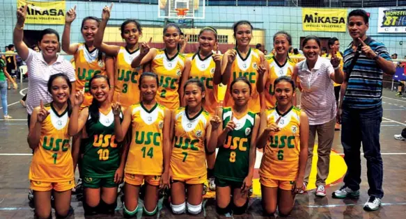  ?? PAUL JUN E. ROSAROSO ?? The University of San Carlos volleybell­es led by coach Vanessa Juezan jubilate after dethroning the University of San Jose-Recoletos in straight sets, 28-24, 25-19, 25-18, to win the Cental and Eastern Visayas leg of the Shakey’s Girls Volleyball...