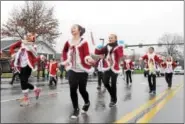  ?? DIGITAL FIRST MEDIA FILE PHOTO ?? Performers from the La Roux School of Dance rock out to Christmas Music during the East Norriton Holiday Parade Saturday, December 6, 2014.