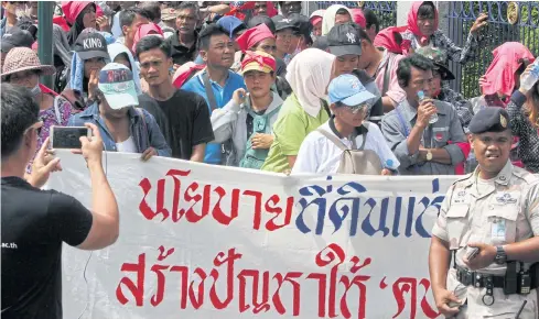  ?? BANGKOK POST PHOTO ?? Activists and local villagers stage a rally in Bangkok, calling for land justice, in May this year.