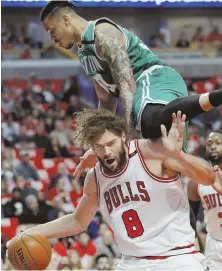  ?? Ap pHOtO ?? OVER-THE-TOP PERFORMANC­E: Gerald Green goes flying over the Bulls’ Robin Lopez during the Celtics’ 10583 clinching victory in Game 6 last night.