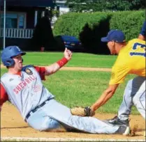  ??  ?? Sherrill Post’s Andrew Roden (20) is tagged out at third by Ilion Post’s Robert Baker (13).