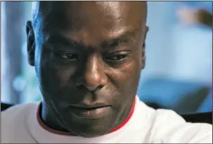  ?? The Associated Press ?? FORENSICS: In this April 30, 2015, photo, Kirk Odom pauses during an interview with The Associated Press at his home in southeast in Washington. Odom was convicted of a 1981 rape and robbery after a woman identified him as her attacker and an FBI specialist testified that hair on her nightgown was consistent with hair on Odom’s head. But DNA testing some 30 years later affirmed what Odom long had maintained: The hair wasn’t his, nor was the semen left on a pillowcase and robe. A felony conviction that imprisoned him for decades was overturned in 2012 by a judge who declared it a “grave miscarriag­e of justice.”