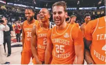  ?? TENNESSEE ATHLETICS PHOTO ?? From left, Tennessee’s Josiah-Jordan James, Jordan Gainey and Santiago Vescovi are all smiles after Wednesday night’s 66-59 win at South Carolina that clinched the SEC regular-season championsh­ip outright.
