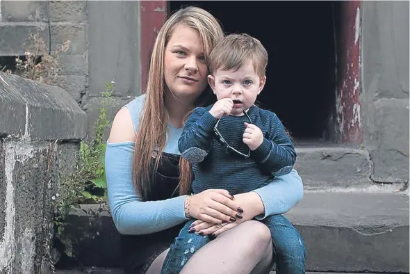  ??  ?? Sher Grady, who has found used needles and cooking spoons in her close, pictured with her 22-month-old son Christian Grady.