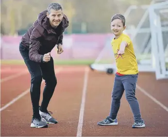  ?? ?? Steve Cram with George Lumley, seven, at the launch of the Durham City Run Festival.