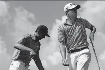  ?? [DAVID GOLDMAN/THE ASSOCIATED PRESS] ?? Justin Thomas, right, watches his shot after teeing off on the sixth hole as Jordan Spieth steps up to hit during the second round of the Tour Championsh­ip on Friday at East Lake Golf Club in Atlanta. CHAMPIONS TOUR: