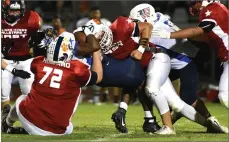  ?? RECORDER PHOTO BY CHIEKO HARA ?? East's Wyatt Della tackles West's runner with Kyle Howard (72) Saturday, during the 50th annual East vs West Tulare-kings Allstar Football game.