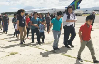  ?? Colleen Long / Associated Press ?? Eleven families, separated in the U.S. under President Trump’s zero tolerance policy, return home to Guatemala City, Guatemala, after being deported from the United States.