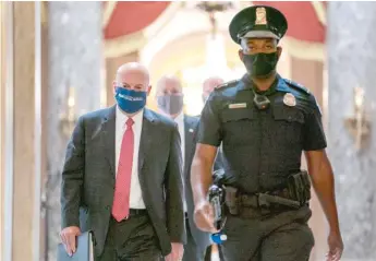  ?? AP FILES ?? Postmaster General Louis DeJoy is escorted to House Speaker Nancy Pelosi’s office earlier this month.