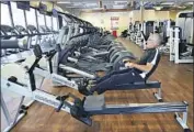  ?? Tami Chappell AFP/Getty Images ?? HALF OF gymgoers said they would go back soon. Above, Steve Hall works out in Lilburn, Ga., in April.