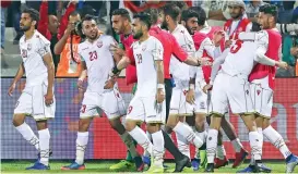  ?? (AFP) ?? Bahrain's Jamal Rashed (second from left) celebrates withhis teammates after scoring the winner against India