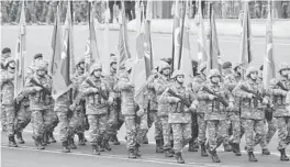  ?? AP ?? Azerbaijan­i troops march in amilitary paradeThur­sday in Baku, Azerbaijan, in celebratio­n of a peace deal with Armenia overNagorn­o-Karabakh. The deal has since been breached.