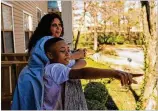  ?? REBECCA WRIGHT FOR THE AJC ?? Tiwanda Evans, who lost her job due to the pandemic, spends time with her grandson, Ralph Jackson, in Austell on Tuesday.