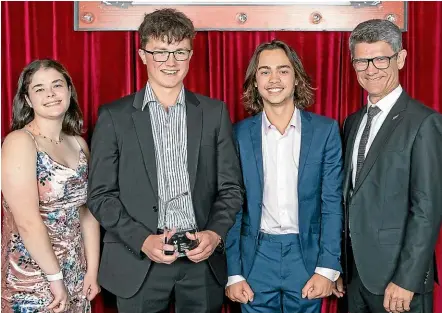  ??  ?? Roncalli College students and Patiti Point company directors, from left, Grace Scarsbrook, Nick Goodwin and Billy Cook with Tourism Industry Aotearoa chief executive Chris Roberts.