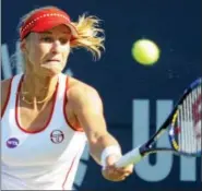  ?? BOB CHILD — FOR THE REGISTER ?? Ekaterina Makarova hits a return to Petra Kvitova on Thursday.