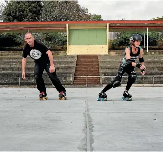  ?? PHOTO: WARWICK SMITH/FAIRFAX NZ ?? Chris Morgan, from the Manawatu Skating Club, and Rachel O’hagan, from Swamp City Roller Derby, try out the improving surface of the Memorial Park skating rink.