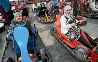  ?? PHOTO: MARK TAYLOR/FAIRFAX NZ ?? First-time drivers Surrayya Husseini, Shafiqa Gulam Ali and Farishta Baqizada at the startline.