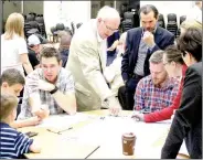  ?? Keith Bryant/The Weekly Vista ?? Mayor Peter Christie, center left, and Tony Garcia of Street Plans Collaborat­ive, center right, discuss the temporary trail at Wednesday’s public input meeting.