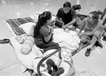  ??  ?? A scene from a shelter during Hurricane Irma in 2017.