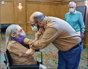  ??  ?? Connie Kendrick and her son, William Kendrick, embrace as they see each other at The William Breman Jewish Home on Thursday in Atlanta.