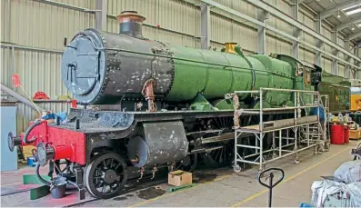  ?? ?? Hagley Hall inside the Traction Maintenanc­e Depot shed at Kiddermins­ter on July 23 for repainting. JOHN TITLOW