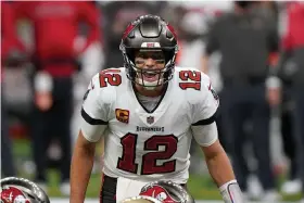  ?? The Associated Press ?? Q Tampa Bay Buccaneers quarterbac­k Tom Brady (12) calls a play at the line of scrimmage against the New Orleans Saints during the second half of Sunday’s NFL divisional round playoff game in New Orleans.