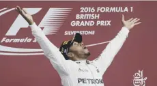  ??  ?? 0 Joy for Lewis Hamilton after winning at Silverston­e last year.