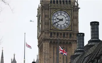  ??  ?? FLAGS FLY at half-mast over the Houses of Parliament in London yesterday.