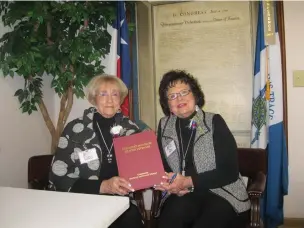  ?? Staff photo by Greg Bischof ?? Frances Whatley, left, and Sue Berry pose with their book “Treasured Memories of World War II Veterans” during a reception honoring Pearl Harbor Day at the American Legion Hall in Atlanta, Texas.