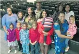  ??  ?? The Walters family grew by three adopted siblings to go with four foster children and their own adult children who gathered at the Broward County Courthouse on Saturday to mark National Adoption Day.