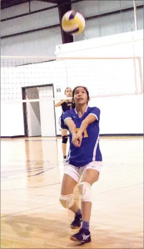  ?? Westside Eagle Observer/MIKE ECKELS ?? Decatur’s Stephanie Sandoval watches intently as she intercepts a Lady Spartan pass during the Aug. 2 Decatur-NWA Classical Academy volleyball match at Spartan gym in Bentonvill­e. The Lady Bulldogs begin their season Aug. 21 at Peterson gym in Decatur.