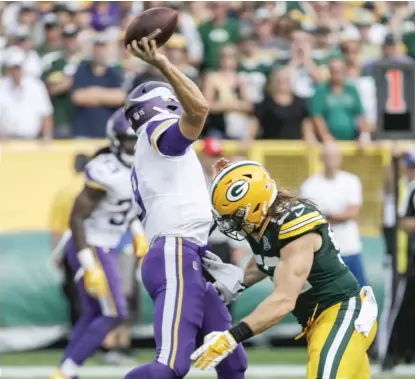  ?? MIKE ROEMER/AP ?? The Packers’ Clay Matthews was called for roughing the passer on this play Sunday against the Vikings.