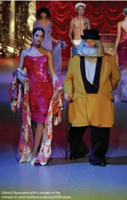  ??  ?? Gérard Boucaron with a model on the runway at John Galliano’s spring 2006 show.
