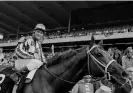  ?? Photograph: AP ?? Jockey Ron Turcotte walks Secretaria­t towards the winners’ circle after winning the 1973 Belmont Stakes before a crowd of 70,000 fans at Belmont Park.