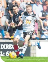  ??  ?? Ayr’s Stephen Welsh evades Ian Mcshane