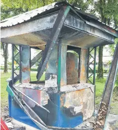  ??  ?? Photo shows the gutted coupon booth at Jalan Simpang Tiga.