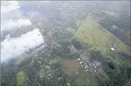  ?? CINDY ELLEN RUSSELL — HONOLULU STAR-ADVERTISER VIA AP ?? The East Rift Zone, along the Leilani Estates neighborho­od, next to the ongoing Kilauea eruption, is seen from a helicopter flying in Pahoa, Hawaii onWednesda­y.