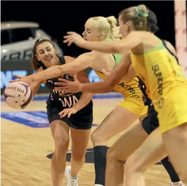  ?? GETTY IMAGES ?? Silver Ferns wing attack Gina Crampton tries to find a way through a congested Australian defence during yesterday’s match in Christchur­ch.