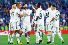  ?? (Photo by Gonzalo Arroyo Moreno/Getty Images) ?? Real Madrid players celebrate after scoring a goal against Melilla in their Copa del Rey match.