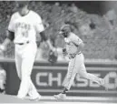  ?? ROSS D. FRANKLIN/AP ?? The Marlins’ Jesus Aguilar, right, rounds the bases after hitting a two-run home run against Diamondbac­ks relief pitcher Joakim Soria during the eighth inning Monday in Phoenix.