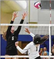  ?? ANDRES LEIVA / THE PALM BEACH POST ?? Jupiter’s Nicole Deka (1) attempts to hit the ball past Park Vista’s Lexi Bertsch in a matchup of ranked volleyball teams. Jupiter won.