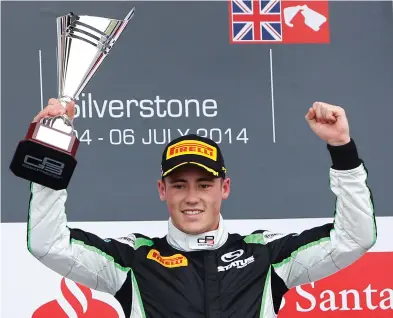  ??  ?? Richie Stanaway holds his trophy for winning the GP3 sprint race at Silverston­e.